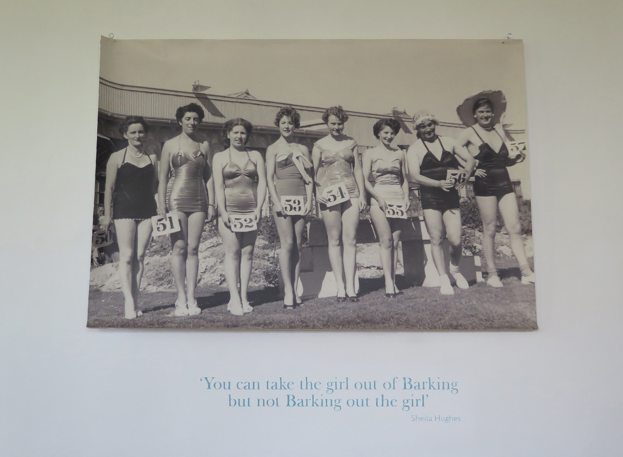 A black and white photograph of a beauty contest with a quote about being a 'Barking girl'
