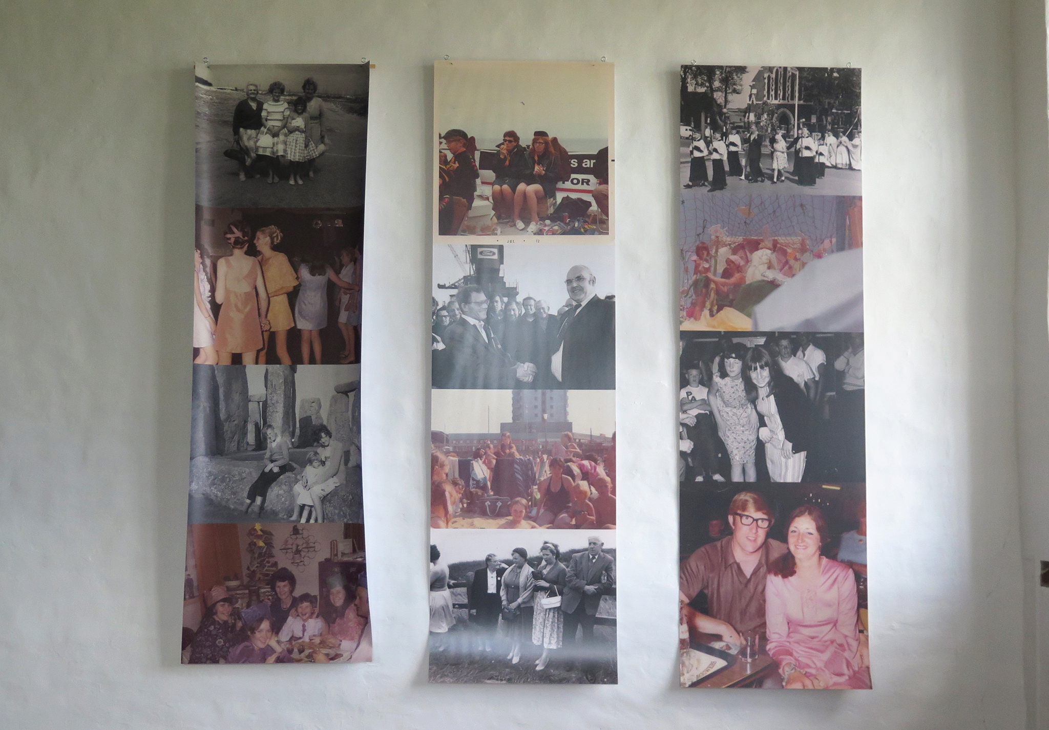 Three large hanging banners with historical photographs of Barking residents